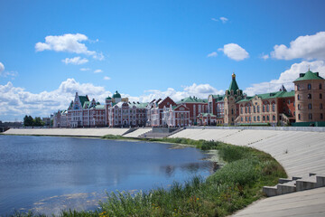 Fototapeta na wymiar Colorful buildings on the river bank . Yoshkar-Ola. Russia
