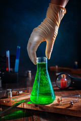 clear green liquid in a chemical flask. Science, chemistry, experiments