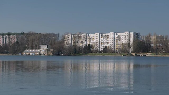 View Kishinev city across lake in city park