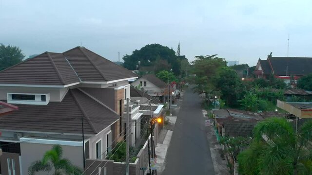 Aerial landscape view of houses and small road in local neighbourhood in Yogyakarta city, Indonesia