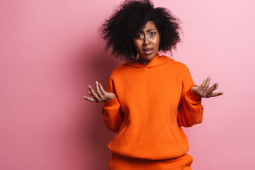 Outraged african american woman looking and gesturing at camera