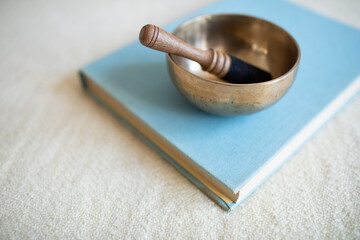 Singing bowl or tibetan bowl and wooden mallet or stick for meditation, mindfulness, sound healing,...