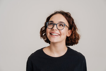 Happy smiling beautiful young woman presenting