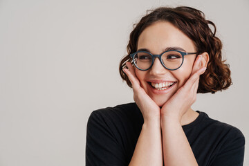 Fototapeta premium Happy smiling beautiful young woman presenting
