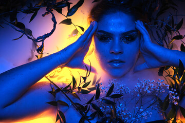 Young beautiful sad woman in the image of the fairy