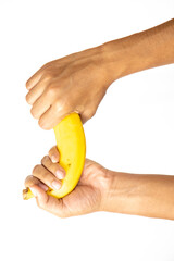 Banana peel aging in hand isolated on white background.