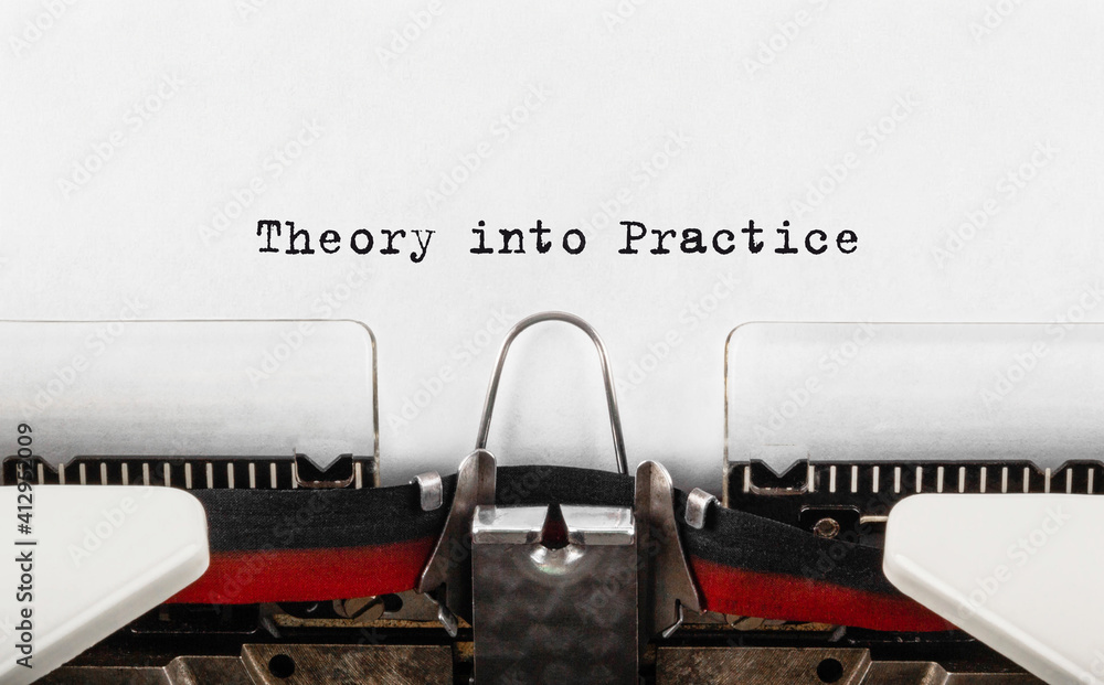 Poster text theory into practice typed on retro typewriter