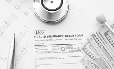 Health Insurance Claim Form. Individual medical health insurance policy with stethoscope and dollar...