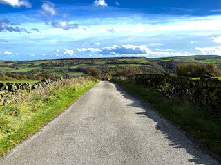 Landscape view, of countryside near, Otter Lee Lane, with dry stone walls, and distant hills in,...