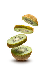 sliced kiwi fruit flying on white background