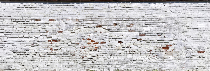 Old white house wall in panorama format.