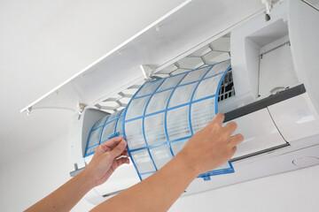 man hand hold air conditioner filter cleaning concept