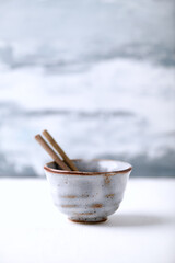 Traditional, handcrafted ceramic on bright wooden background. Copy space.	