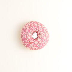 Pink donuts with white crumb on a white background