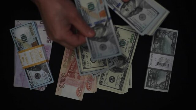 Hands counting US dollar bills on money background 4K