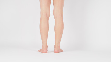 Back of Asian Male legs and barefoot is isolated on white background.