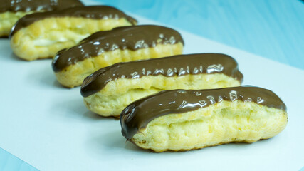 chocolate eclairs on white background