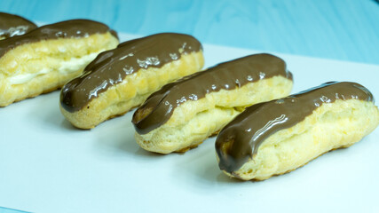 chocolate eclairs on white background