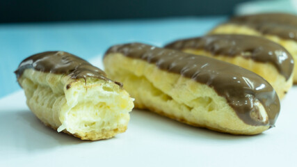chocolate eclairs on white background