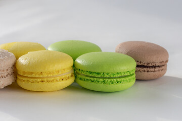 close-up of delicious French pastries. Macaron. Photo in daylight, light background, horizontal.