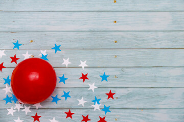 Colorful balloons and on wooden table top view. Festive or party background. Flat lay style....