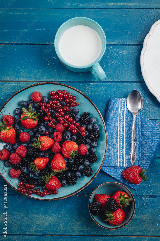 Sticker Healthy breakfast eating a mix of fresh berries fruits