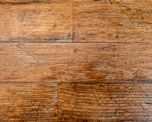 weathered natural wooden planks pattern closeup, brown background