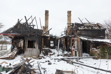 Burnt wooden house. House after the fire. House destroyed in a gas explosion .