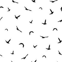 Seamless abstract pattern with black flying birds on white background.