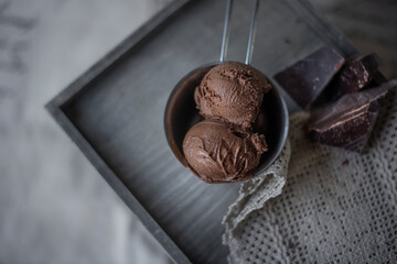 home made chocolate ice cream with chocolate pieces top view rustic style