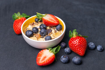 Fruit and Nut muesli with Strawberries and Blueberries. Organic Milk.