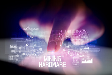 Finger touching tablet with web technology icons and MINING HARDWARE inscription