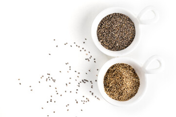 Crushed chia seeds in a ceramic bowl on a white background close-up. Replacing eggs in cooking. Flax egg.