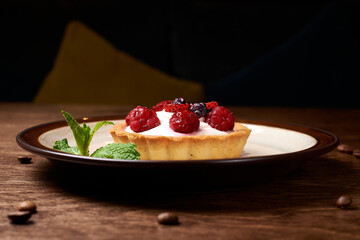 sweet dessert in a round plate on a wooden background