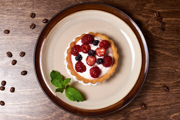 sweet dessert in a round plate on a wooden background