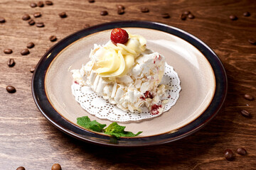 sweet dessert in a round plate on a wooden background