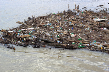 accumulated garbage and plastic waste on the river in Belgrade
