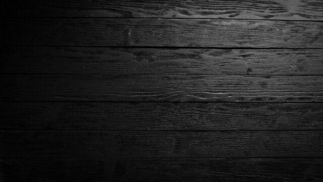 Black wooden background. Top view. Free space for your text.