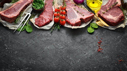 Meat. Set of raw steaks - t-bone, tomahawk, striploin, tenderloin, new york steak. Flat lay top...