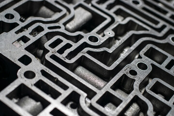 Close up automatic transmission control center variator gearbox valve body on black background