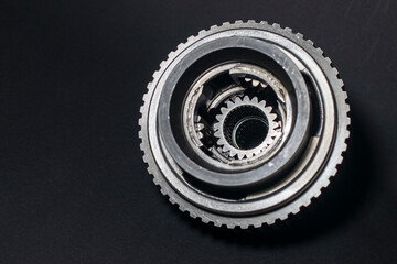 Close up planetary gear on dark background