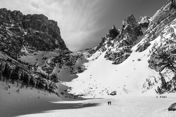 Crossing the frozen surface of Emerald Lake in Rocky Mountain National Park in Black and White