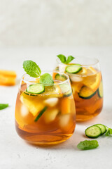 Fresh cool cucumber orange vanilla  iced tea in glasses. Space for text.