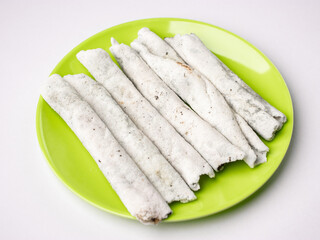 Til pitha a traditional food of Assam  isolated stock image.
