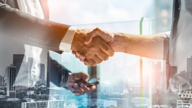 Businessman handshake for teamwork of business merger and acquisition,successful negotiate,hand shake,two businessman shake hand with partner to celebration partnership and business deal concept