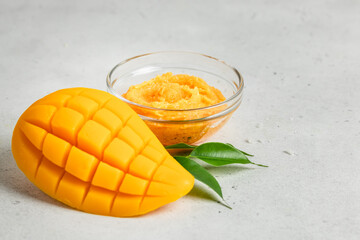 Spa natural minimal cosmetics, mango shaped homemade soap, salt, scrub. Space for text.
