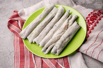 Til pitha a traditional food of Assam  isolated stock image.