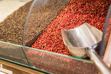 Closeup of different spices on oriental spice sale market. Red and black peppercorn