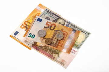 Obraz na płótnie Canvas Dollars, euros, rubles and pounds lie on the surface