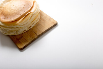 stack of pancakes on the board, copy space